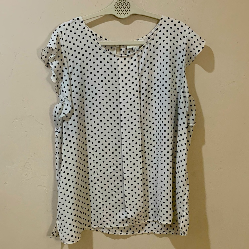 White and black polka dot professional top.